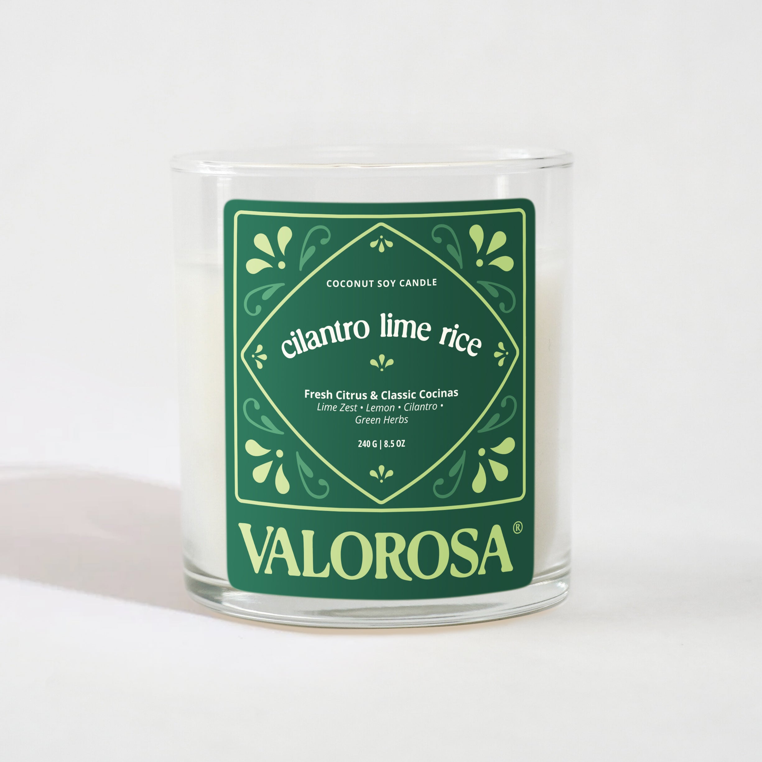 Candle with a green label on a white background