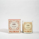 Valorosa coquito candle and packaging on a white background