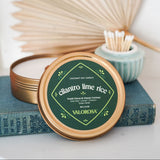 Coconut soy candle with 'Valorosa' branding on a white surface with decorative elements.