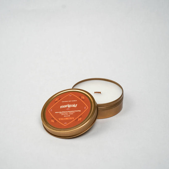 marigold candle tin with a label on a white background