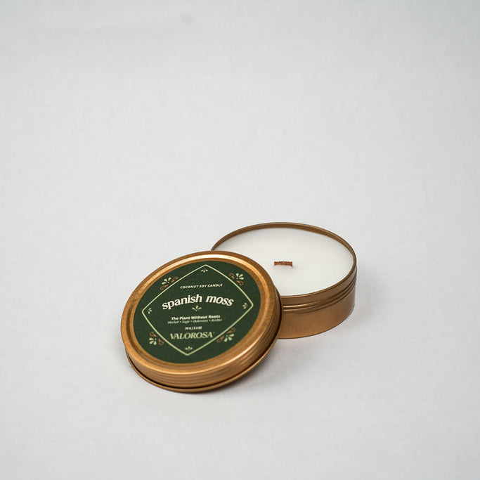 Round candle tin with 'Spanish Moss' label on a white background