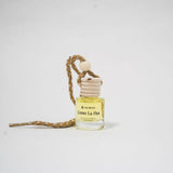 Car Diffuser bottle with wooden cap on a white background